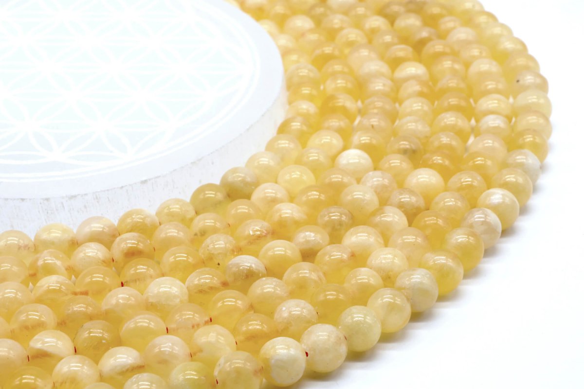 Perles Calcite Orange 8mm sur fil 40cm